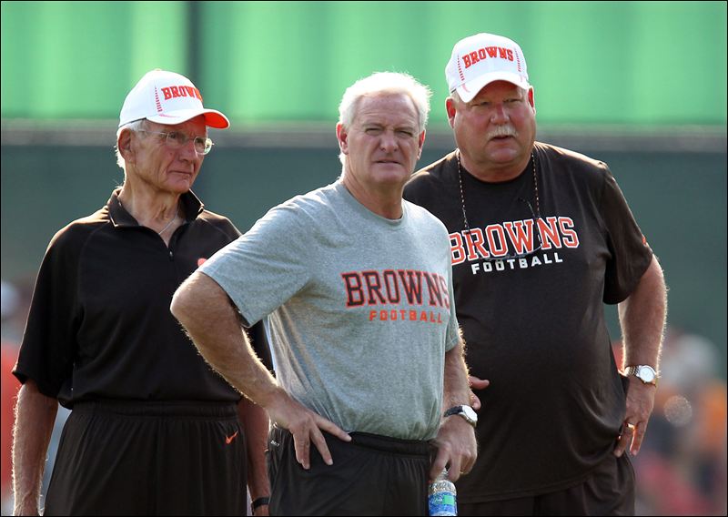 The good old days: Browns owner Jimmy Haslam III (center) surveys the scene in Cleveland with his father, Jimmy Haslam Jr. (left), and then-president Mike Holmgren (right) in August.