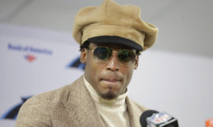 Cam Newton dresses up after the Panthers played the Bears. 