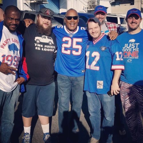 Bills fans take a picture with O.J. Simpson.