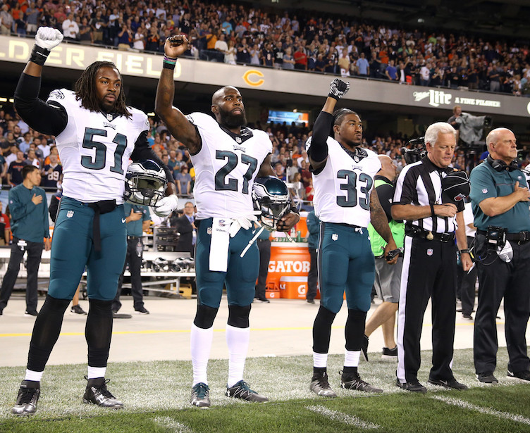 The Eagles protest in advance of a game against the Bears